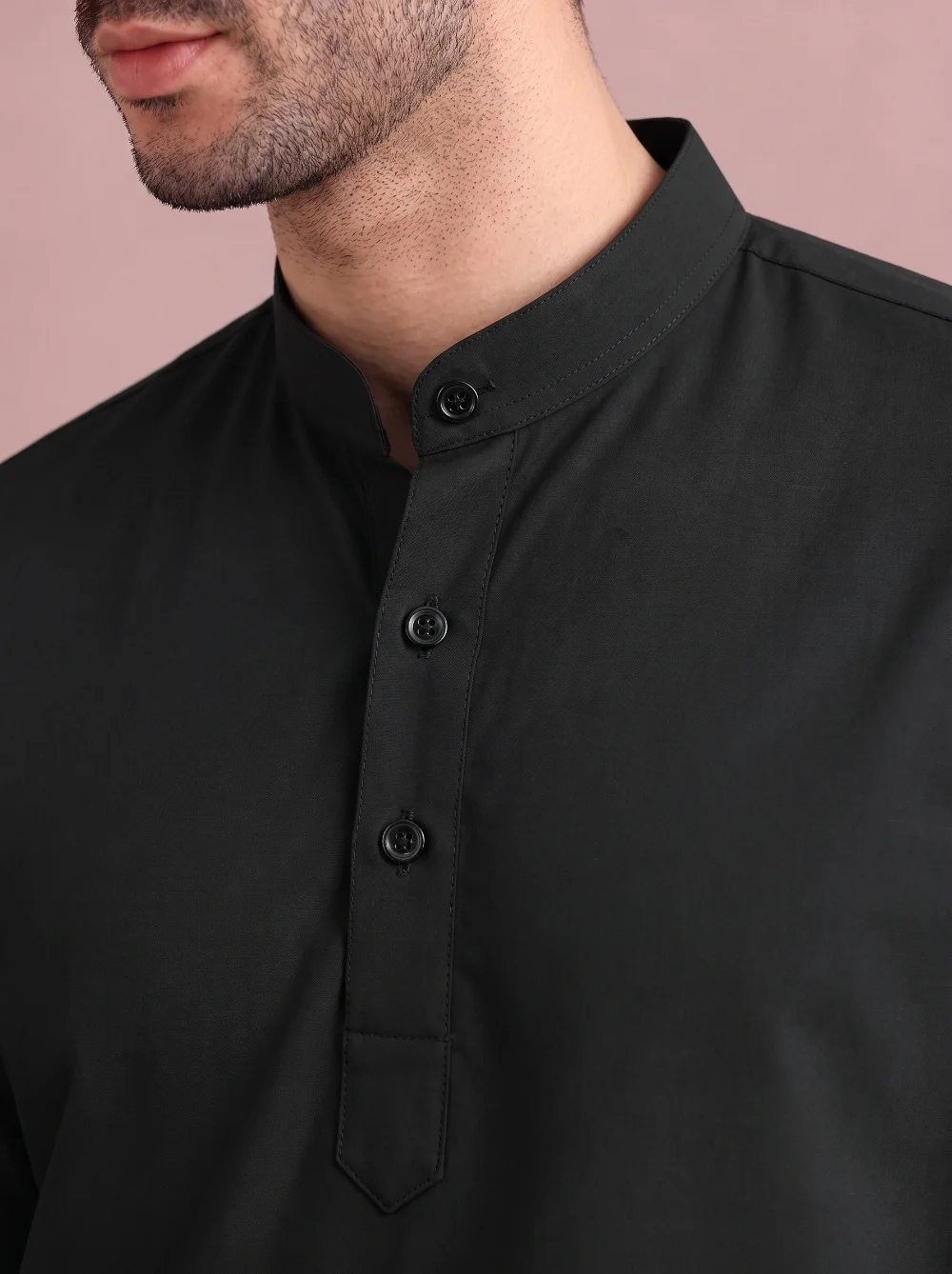 Black kurta, collar and button placket visible, worn by a model