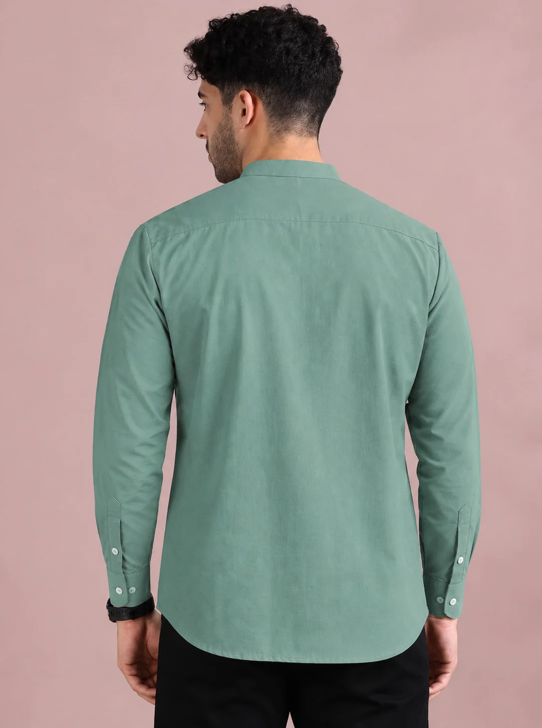 Mint green kurta, back view, worn by a model, long sleeves, buttons on cuffs