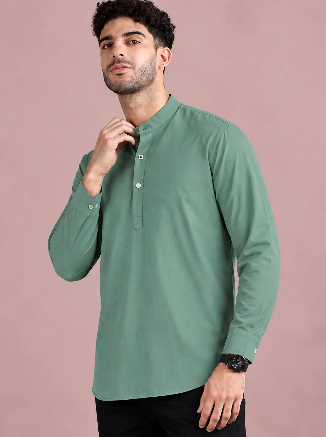 Green kurta, long sleeves, mandarin collar, four buttons, worn by a model