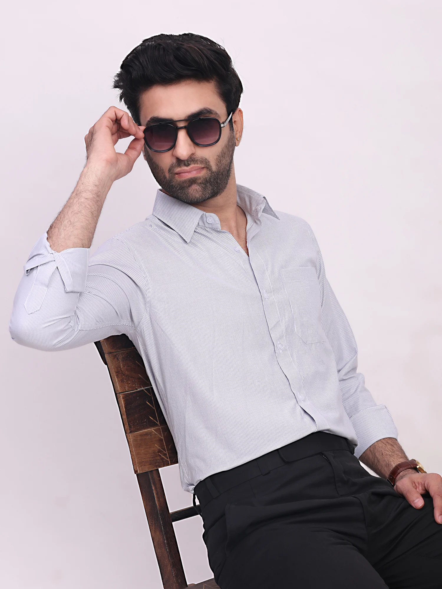 Sky blue striped shirt, worn by a model, front view, collar open, long sleeves