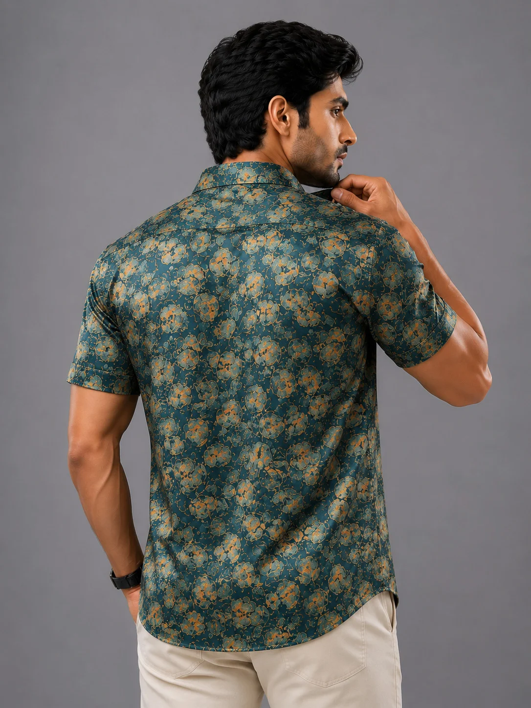 Short sleeved shirt, blue & orange floral print, back view, worn by a model