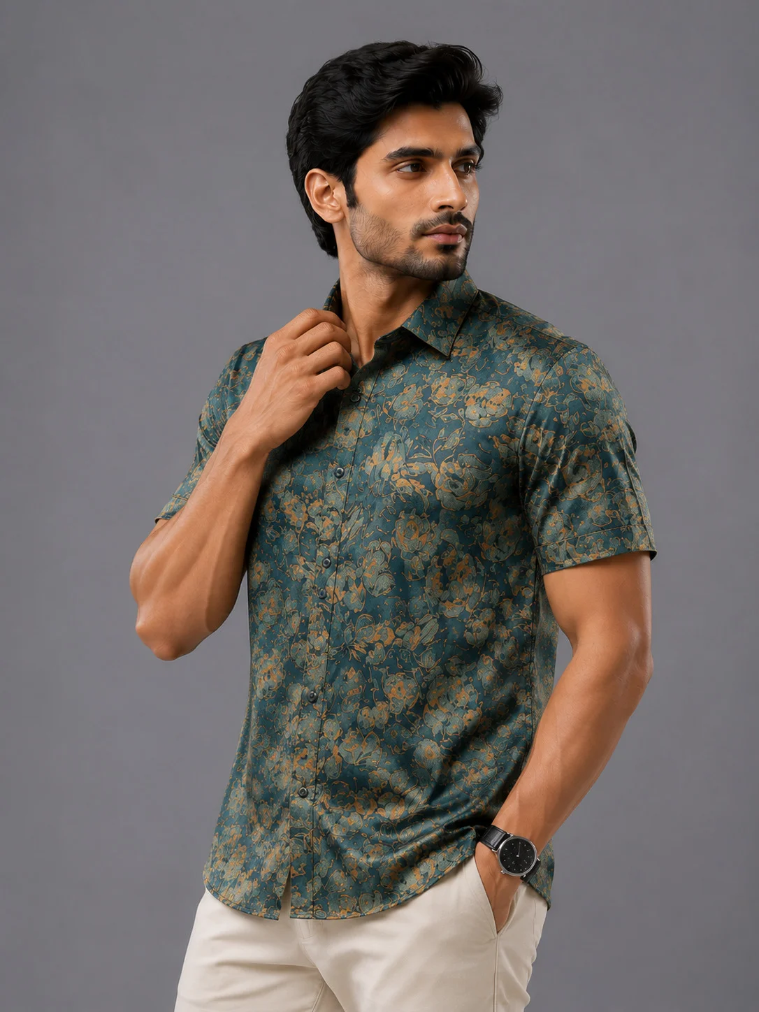 Short sleeved shirt, slate blue with orange floral print, collar, buttons, worn by a model