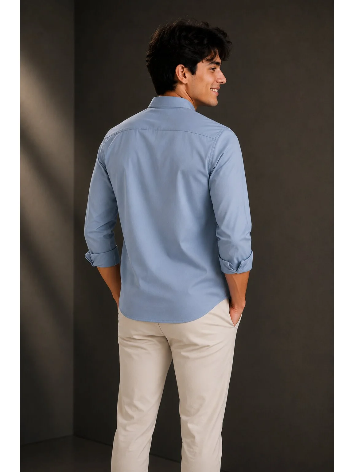 Light blue short kurta, back view, worn by a model, rolled sleeves