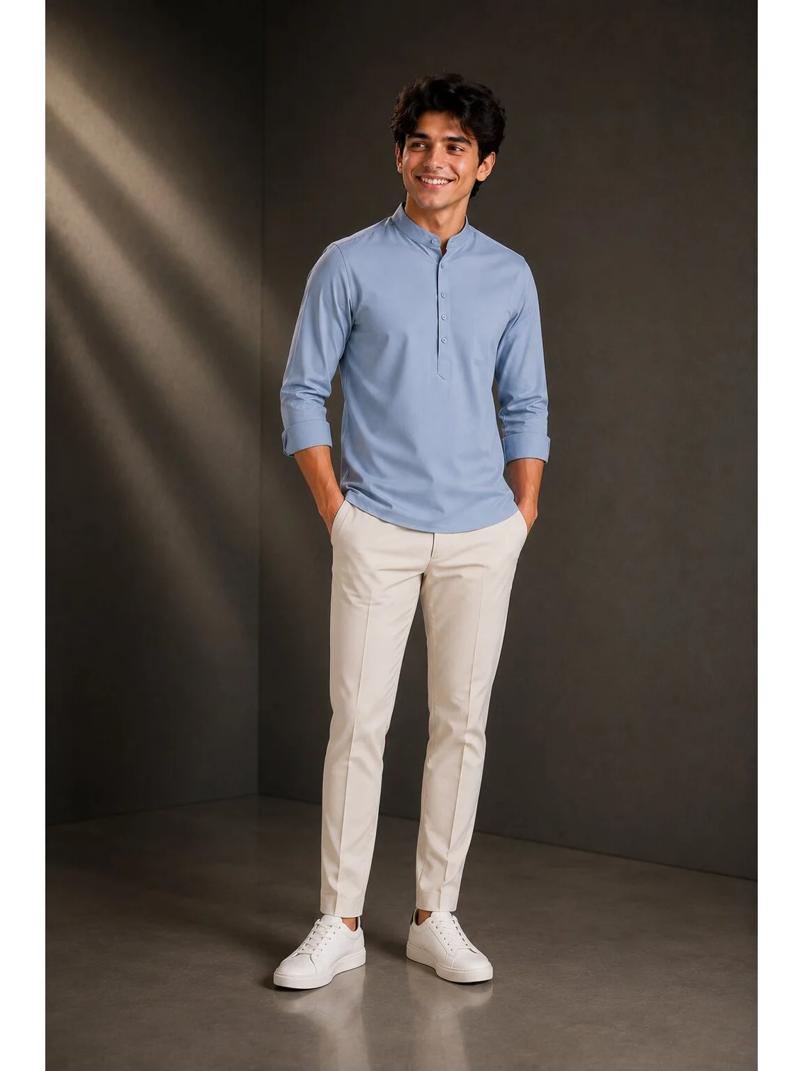 Light blue kurta, worn by a model, mandarin collar, three buttons, long sleeves, pocket on chest