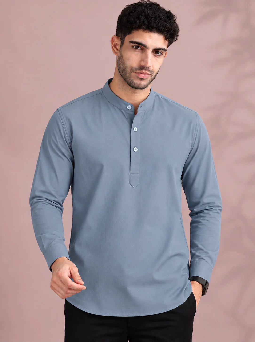 Blue kurta, long sleeves, mandarin collar, three buttons, worn by a model