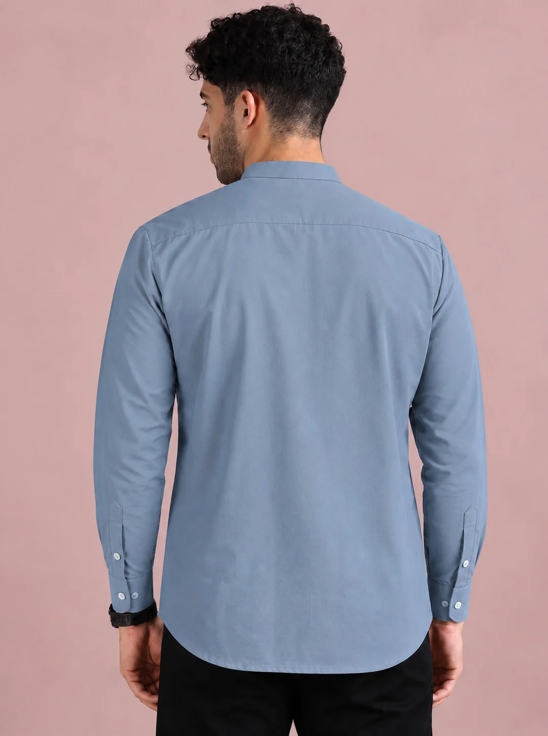 Light blue kurta, back view, worn by a model, long sleeves, buttons on cuffs
