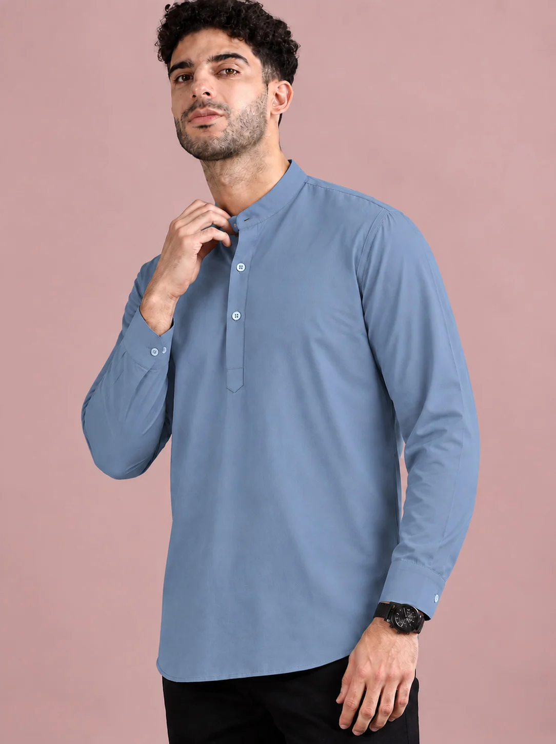 Blue kurta, long sleeves, mandarin collar, buttons down front, worn by a model