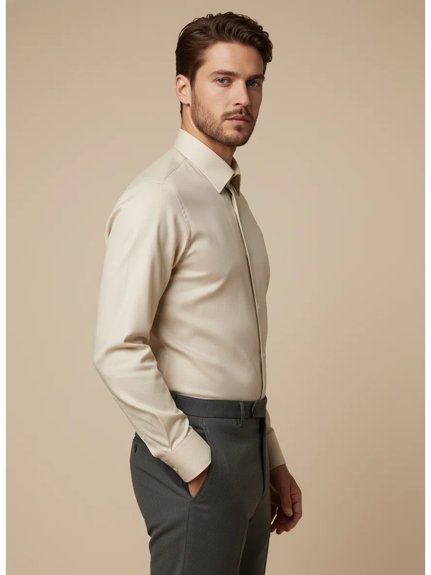 Side view of a model wearing a beige long-sleeve shirt with collar and cuffs