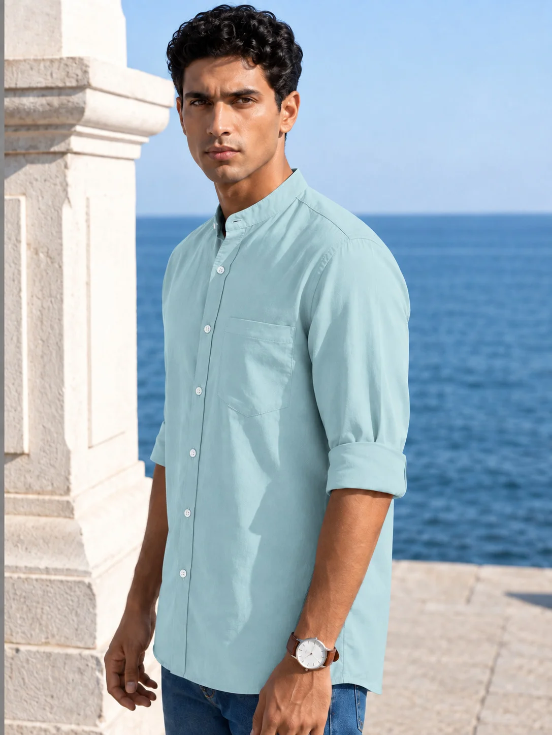 A model wearing a sea green long-sleeve shirt kurta with a mandarin collar, button placket, and a chest pocket