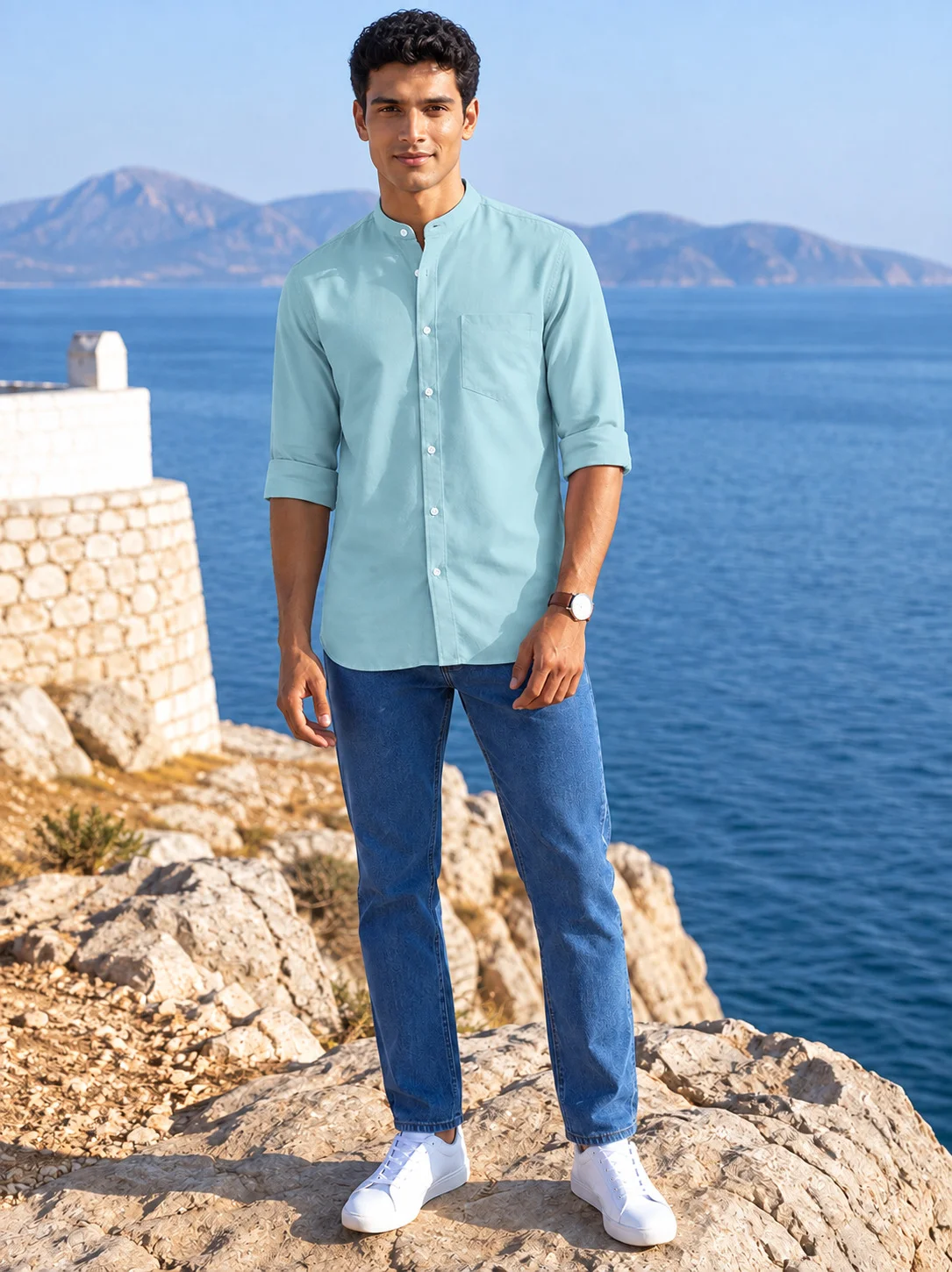 Front view of a model wearing a sea green long-sleeve shirt kurta with mandarin collar, chest pocket and buttons