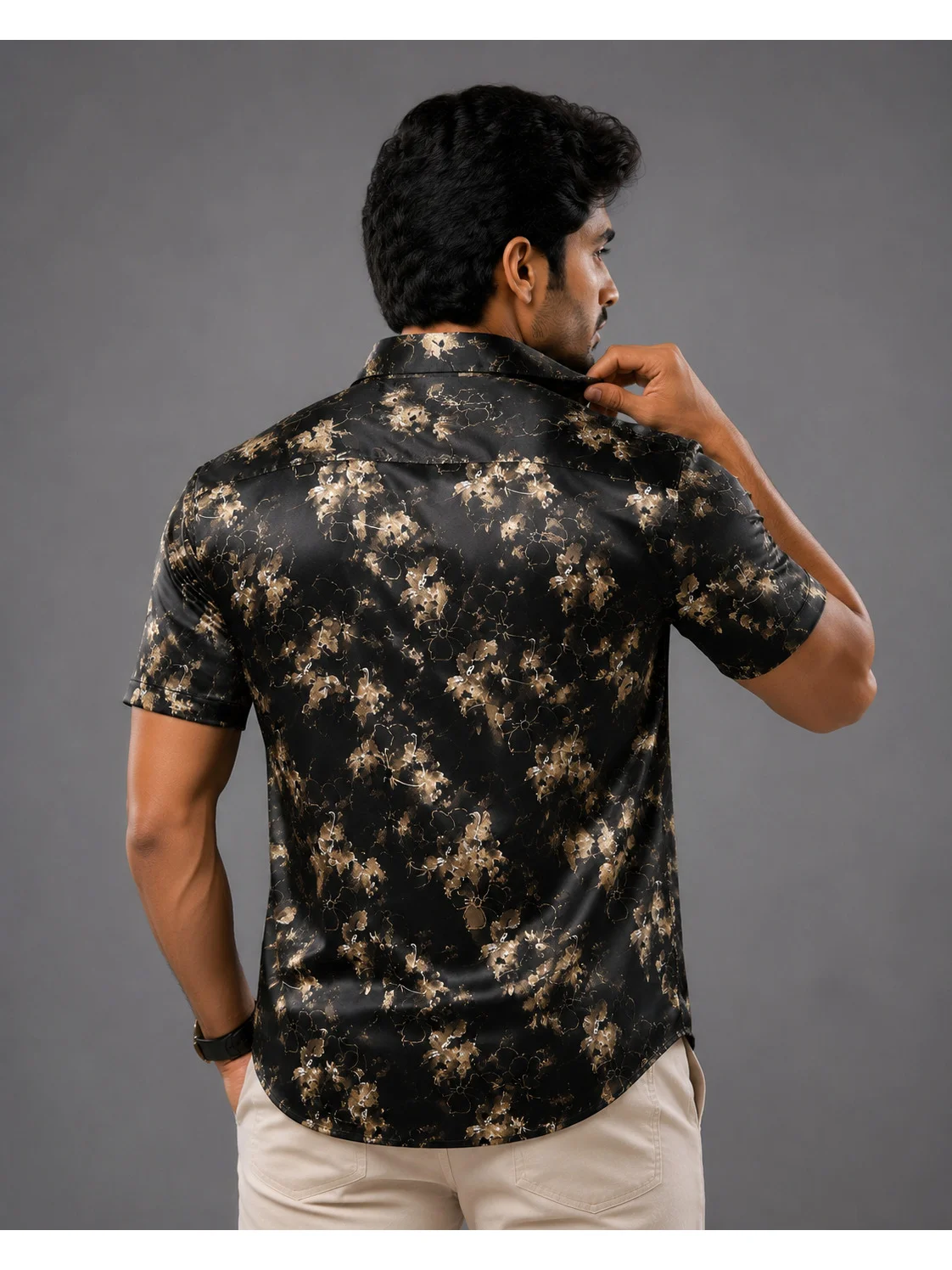 Black and beige floral print short-sleeve shirt, back view, worn by a model
