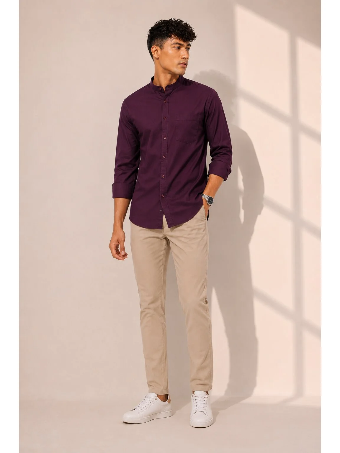 Model wearing a wine purple mandarin collar shirt with full sleeves and chest pocket, front view