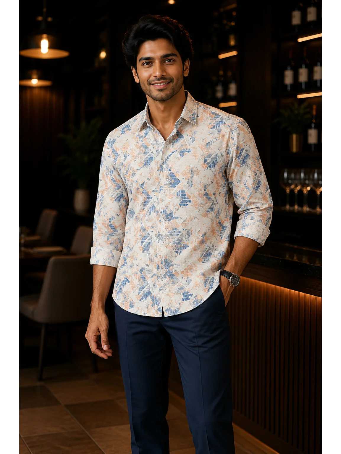 Long sleeve shirt, white with blue and orange pattern, collar, buttons, rolled sleeves, worn by a model