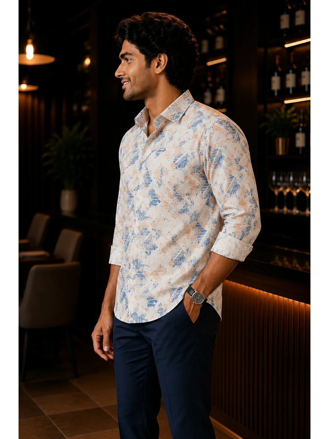 White and blue abstract printed shirt, worn by a model, side view, collar visible, sleeves rolled up