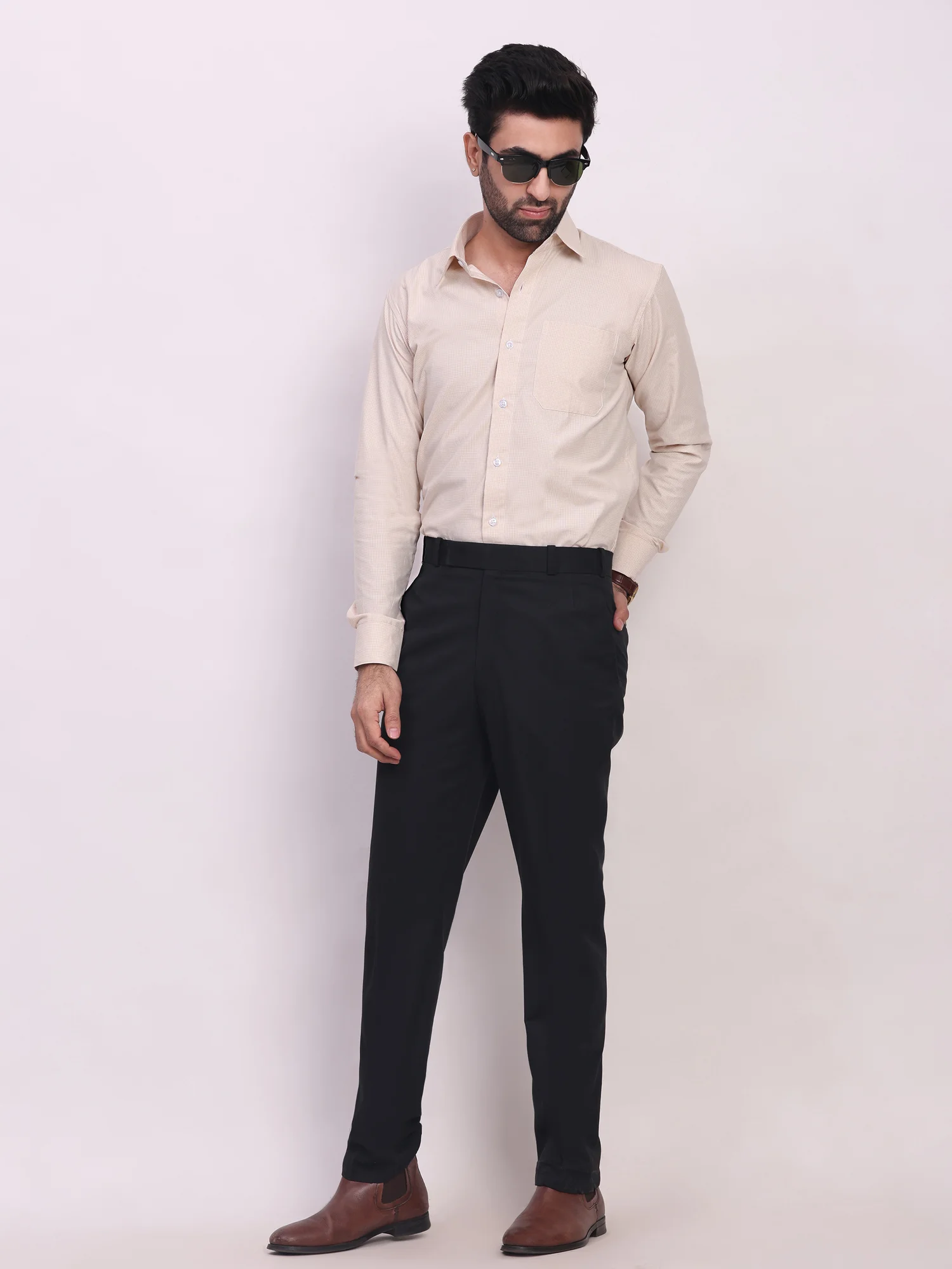 Beige long-sleeve button-down shirt, collar visible, one chest pocket, worn by a model