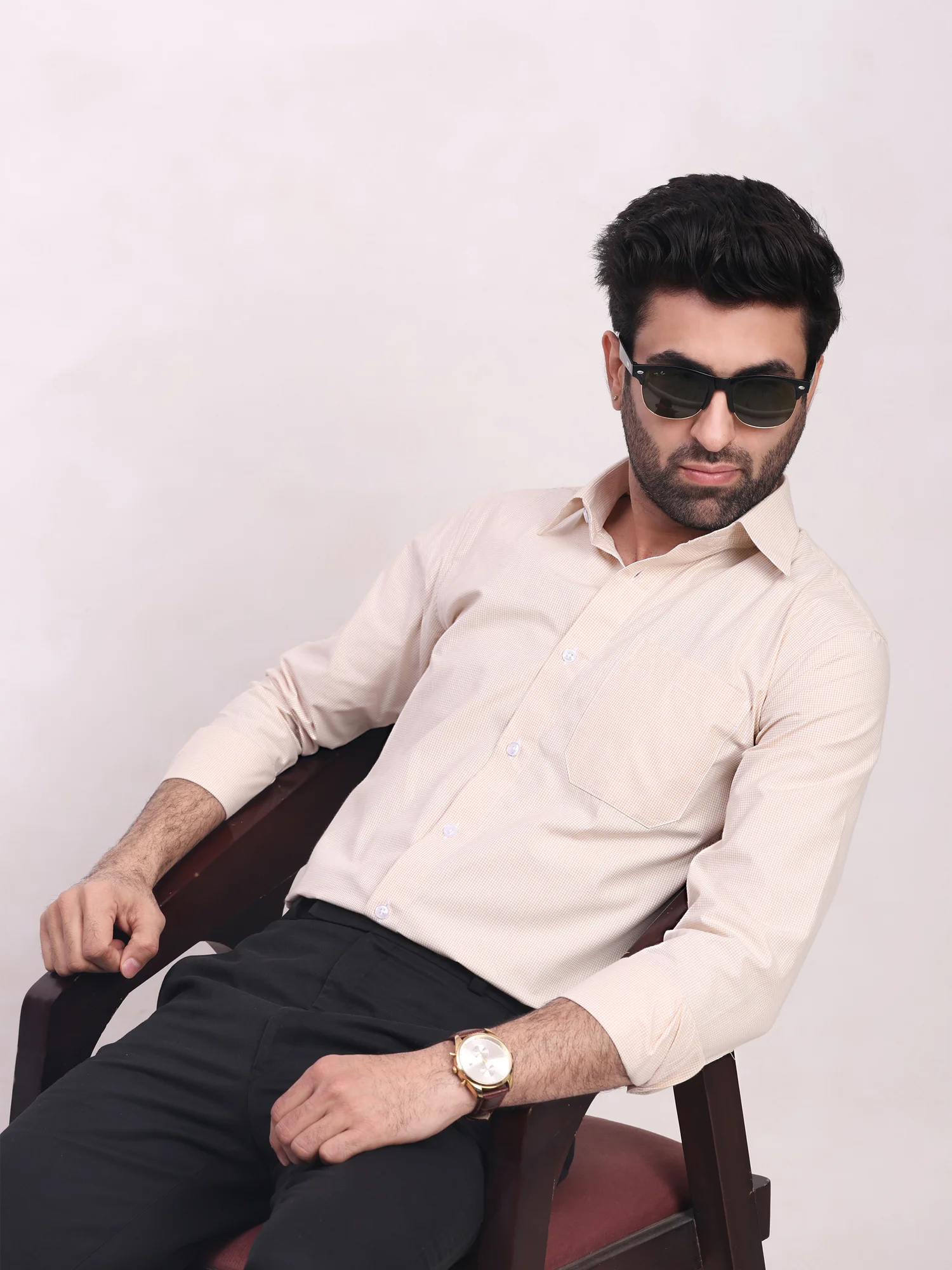 Beige checkered shirt, worn by a model, front view, long sleeves, collar, buttons