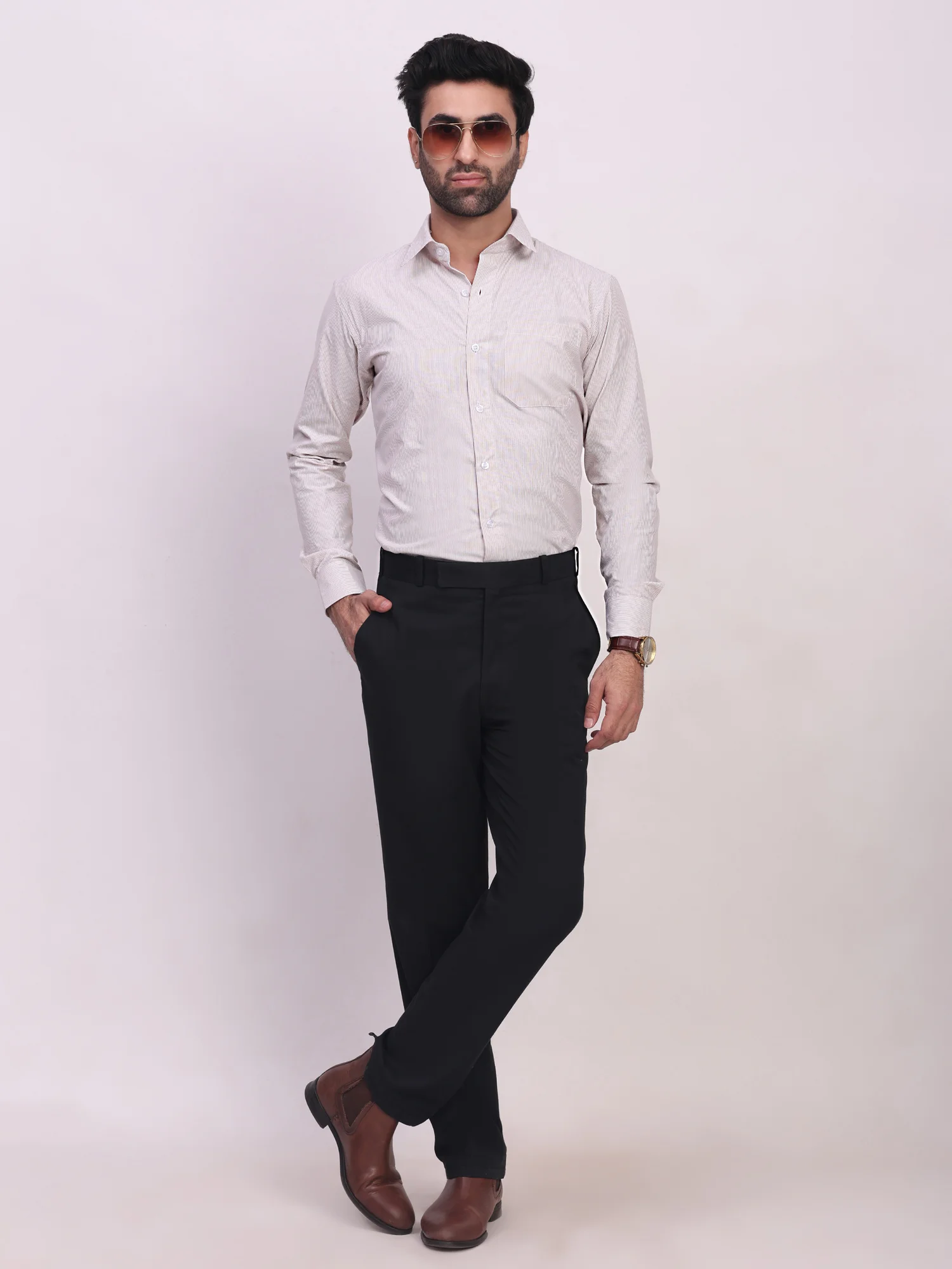 Cream coloured striped shirt, front view, worn by a model, long sleeves, collar, buttons, chest pocket
