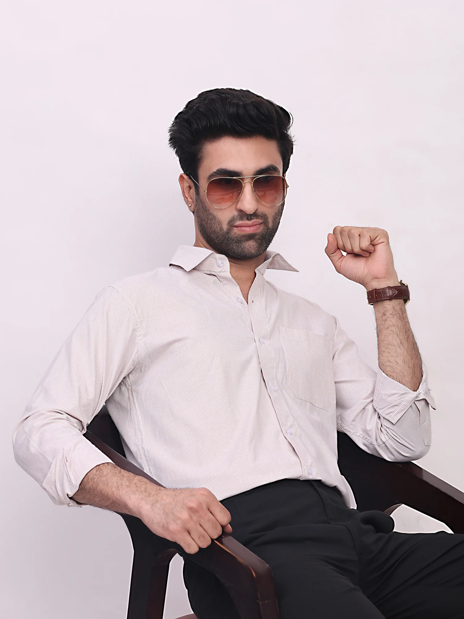White striped shirt, front view, worn by a model, collar spread, buttons, pockets, sleeves rolled up