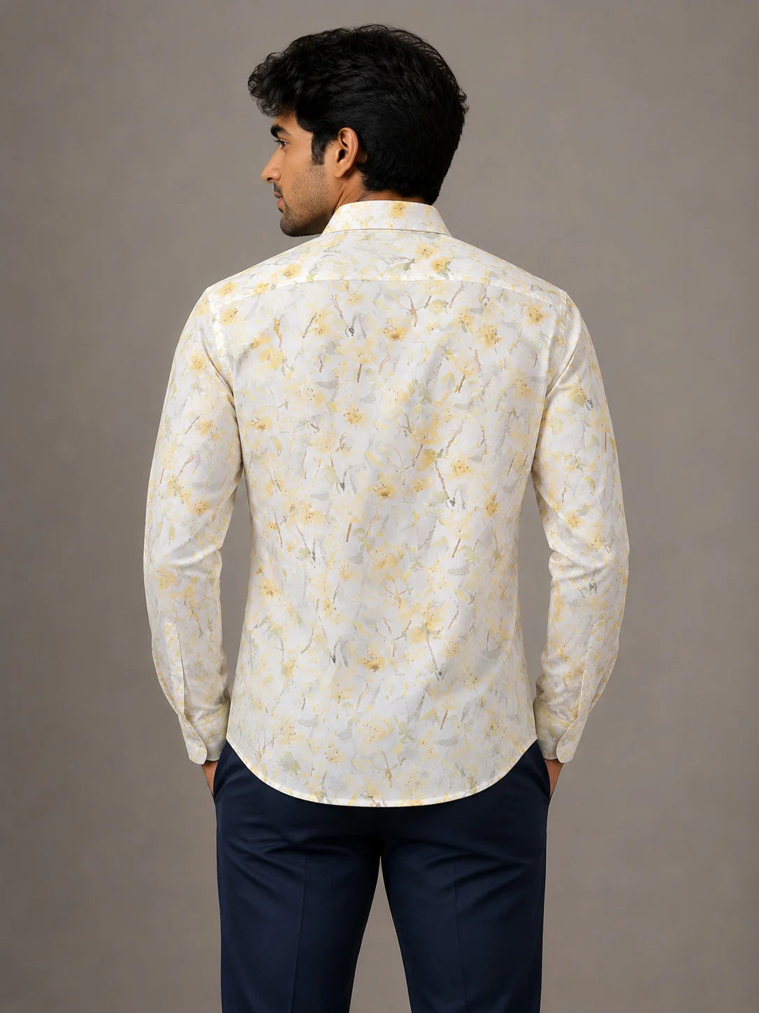 Long sleeve shirt, white with yellow pattern, back view, worn by a model