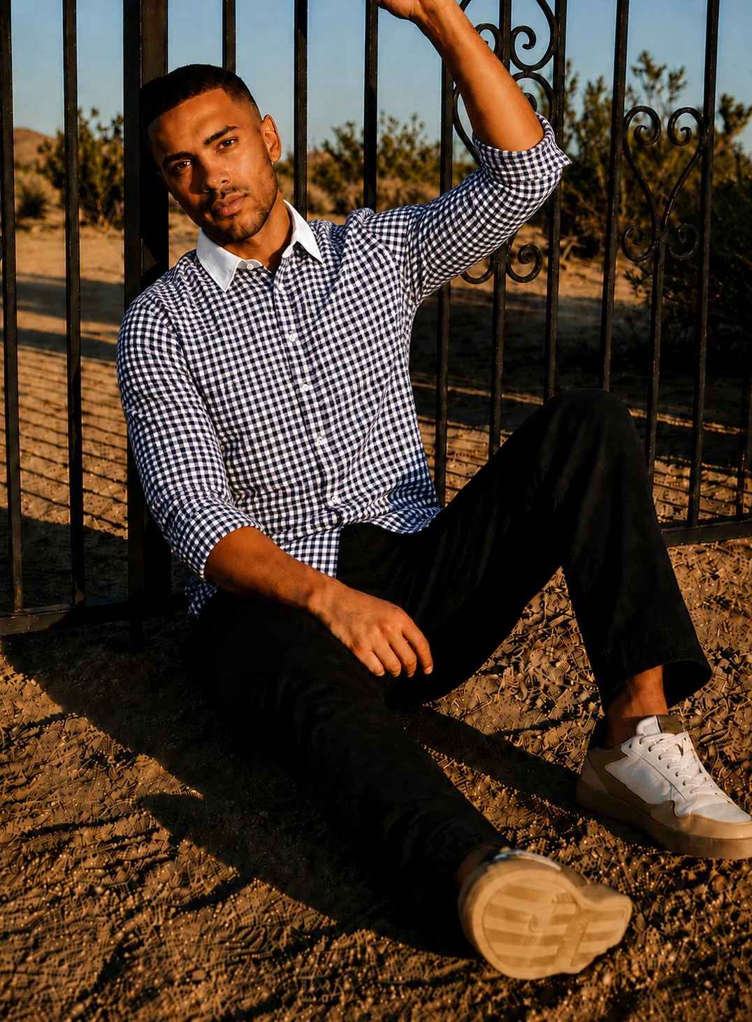 Blue and white checkered shirt, collar visible, buttoned front, full sleeves, worn by a model