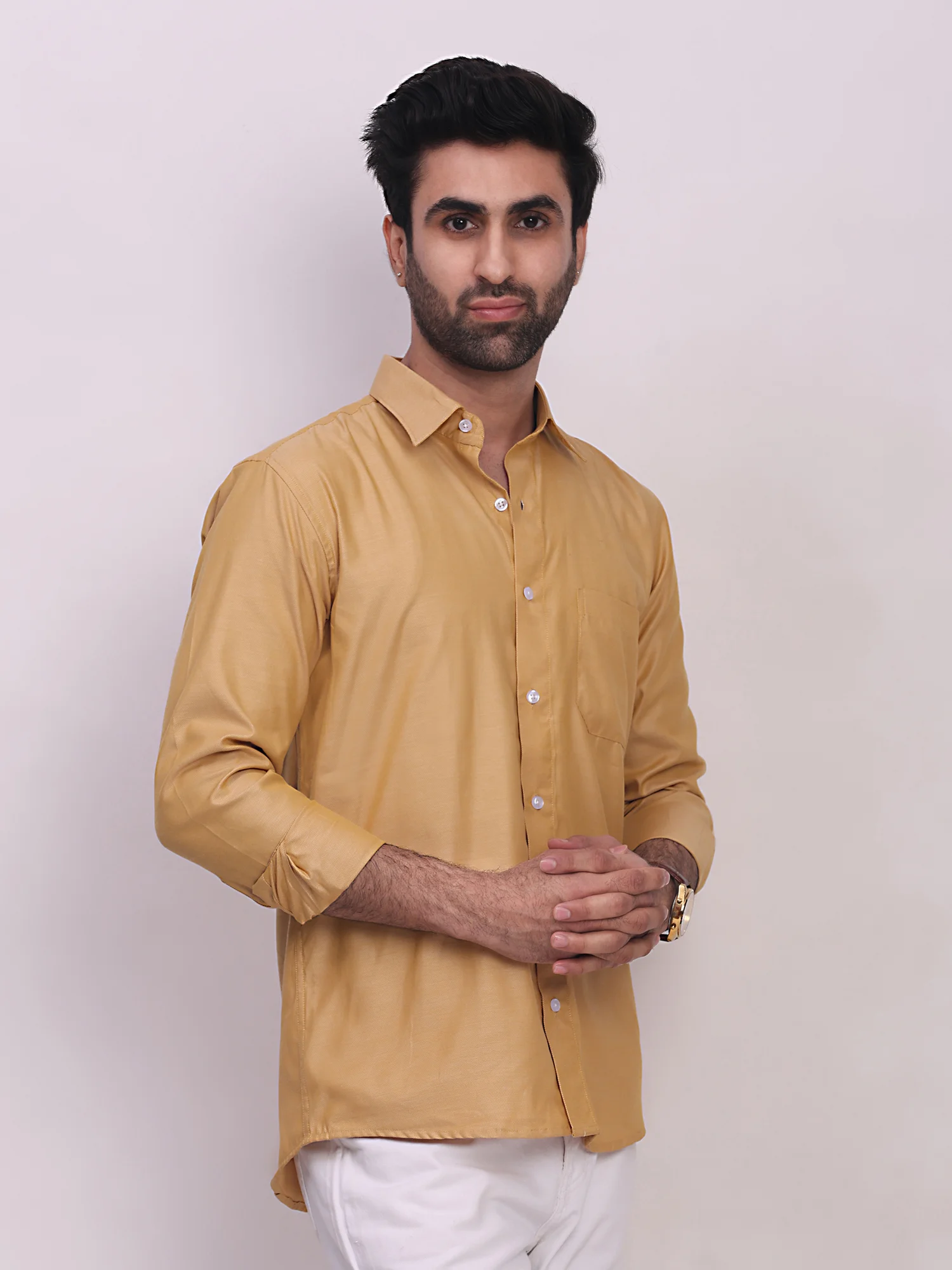 Model wearing golden yellow long-sleeve shirt with collar, front buttons, and chest pocket