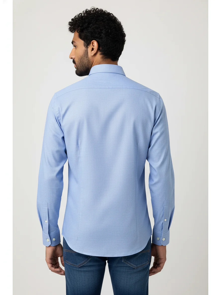 Model wearing back view of a solid blue long-sleeve shirt with collar