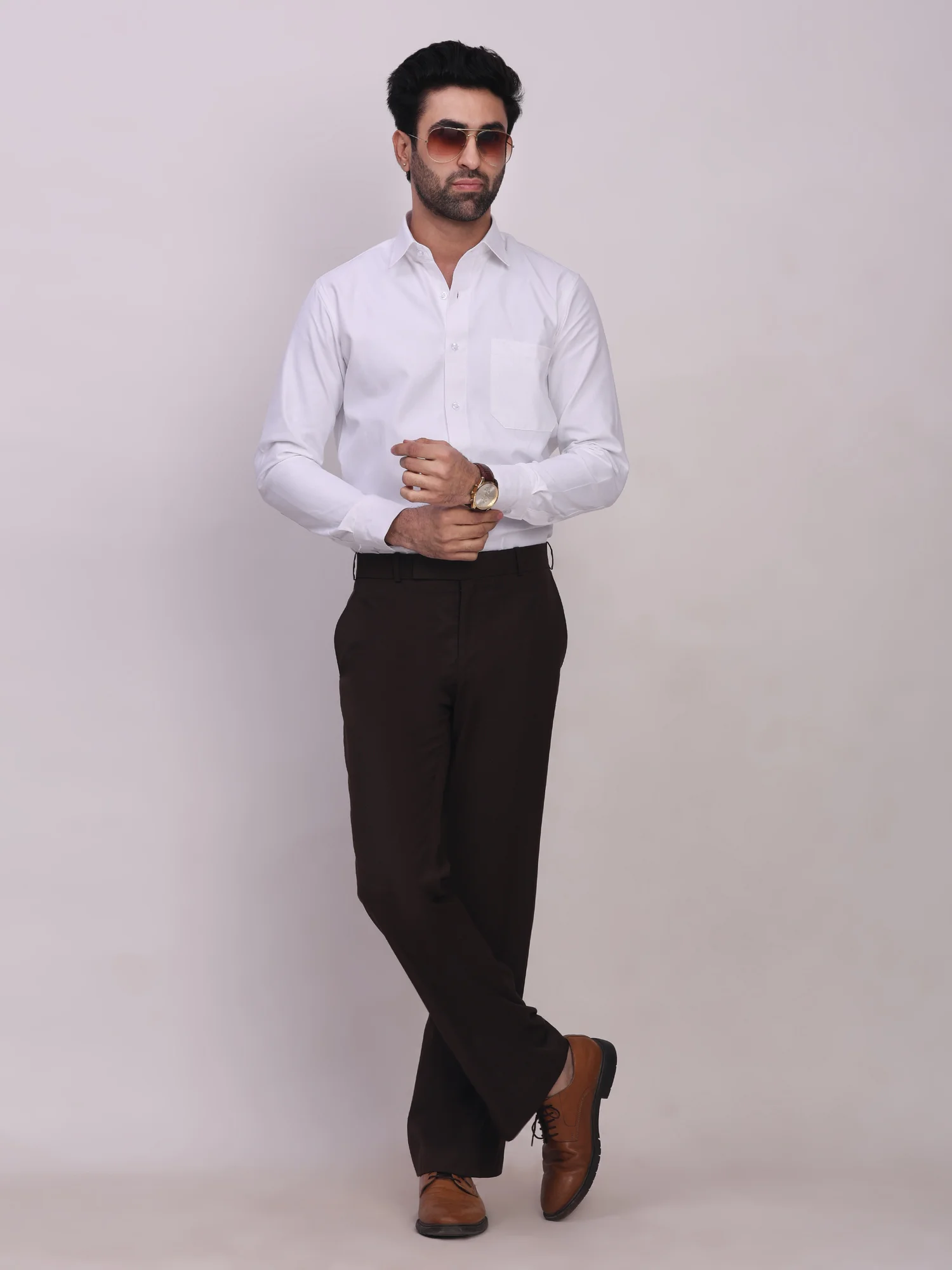 Front view of a model wearing a white long-sleeve shirt with a pointed collar, chest pocket, and front buttons