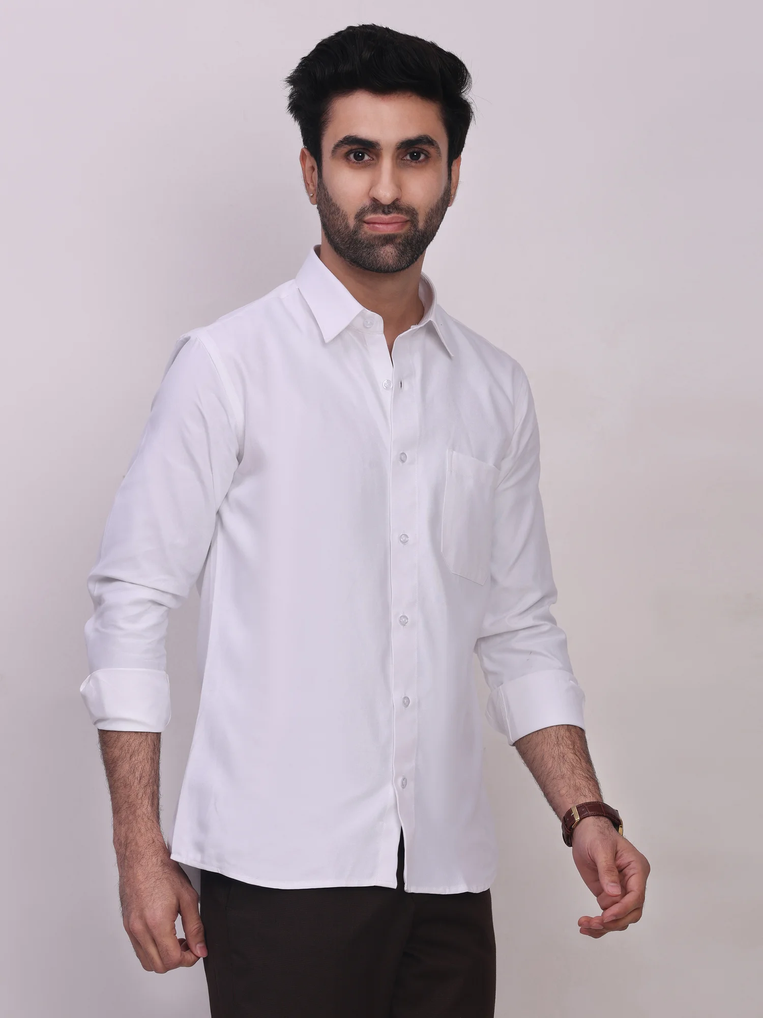 Front view of a model wearing a white long-sleeve shirt with a collar, button placket, and single chest pocket