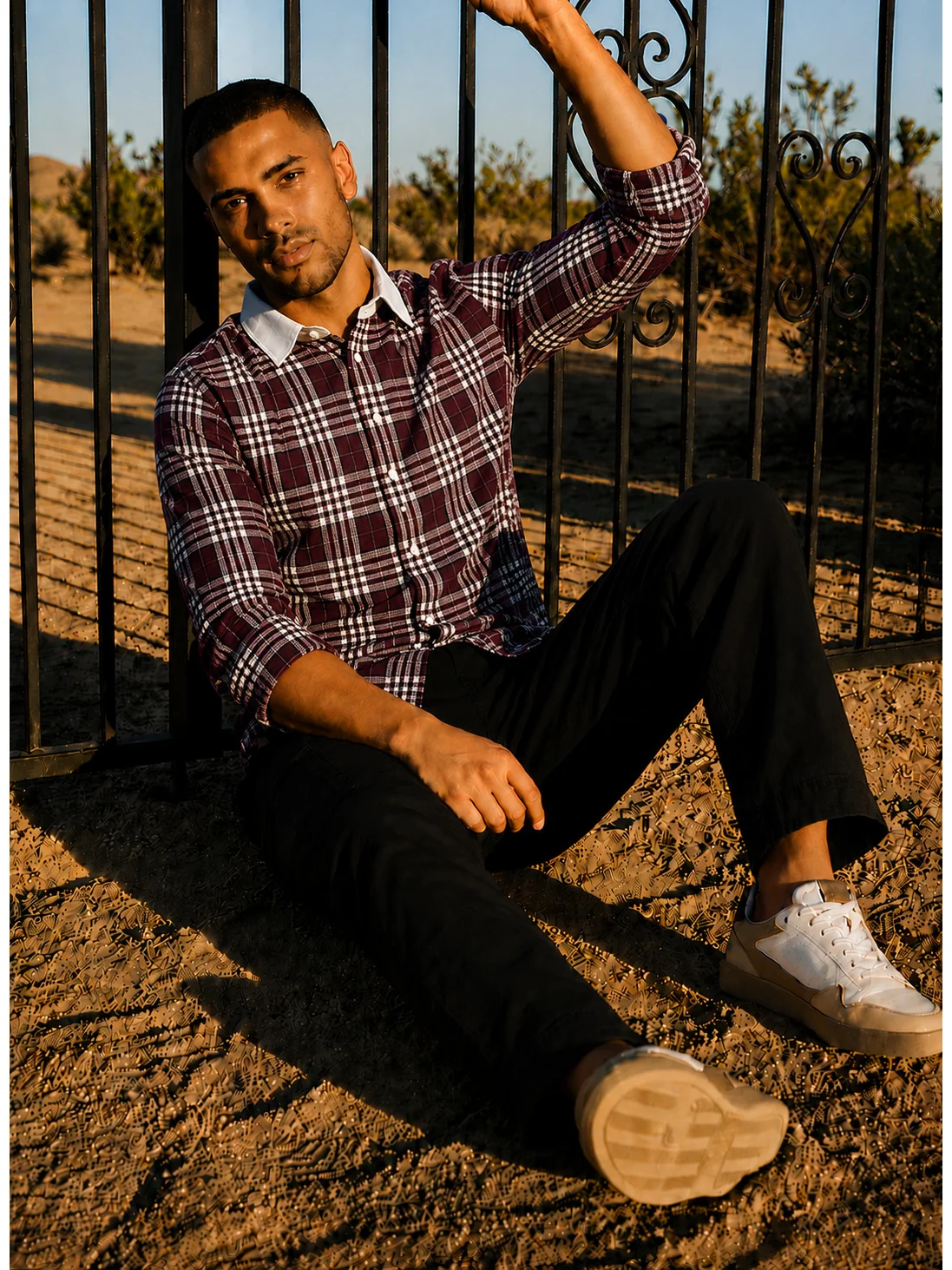 Maroon and white checkered shirt, worn by a model, front view, buttoned up, collar visible, sleeves rolled up