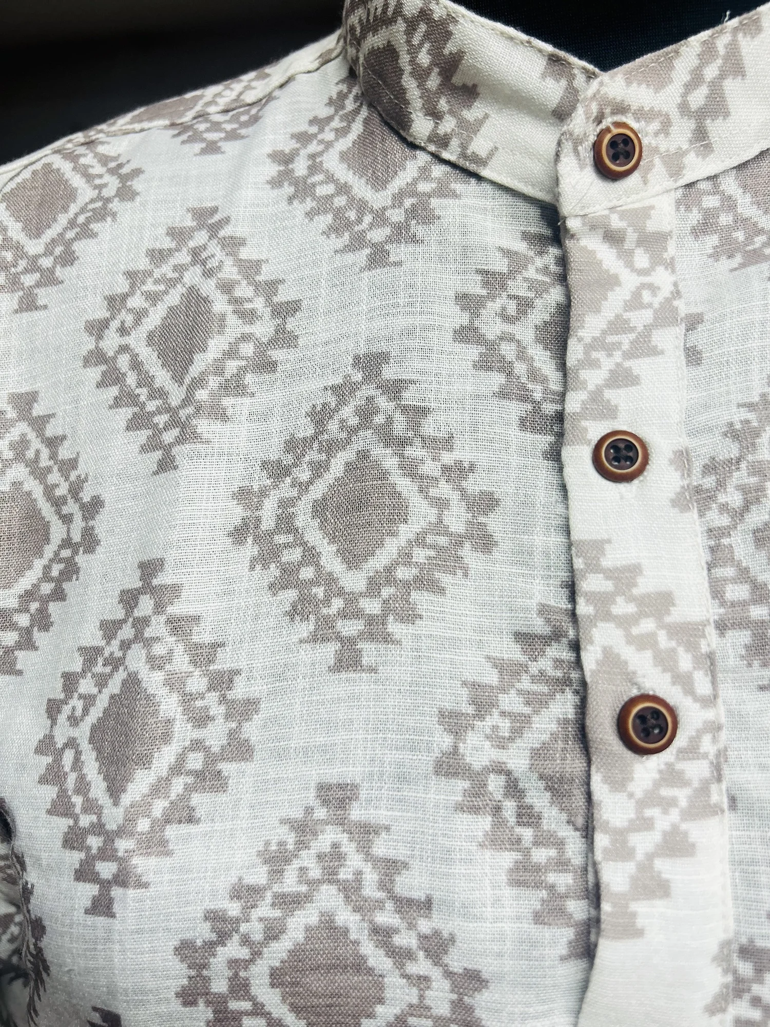Shirt, off-white and taupe, mandarin collar, button placket, geometric pattern, close-up