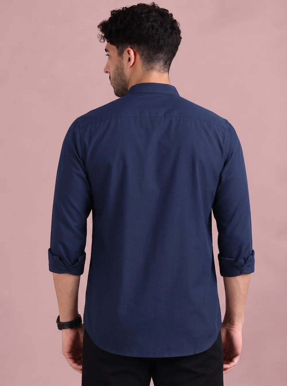 Navy blue kurta, back view, worn by a model, three-quarter sleeves rolled up