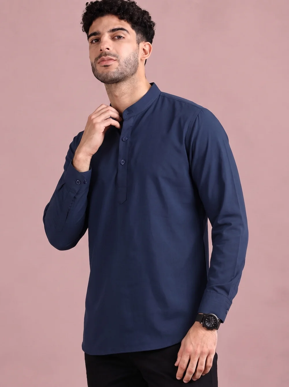 Navy blue kurta, long sleeves, mandarin collar, buttons down front, worn by a model