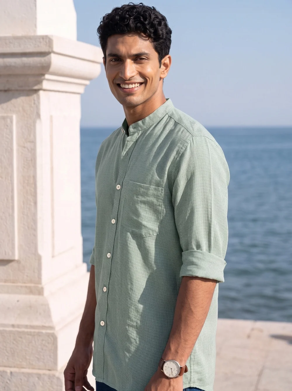 Green kurta with mandarin collar, buttons, rolled sleeves, and pocket. Worn by a model