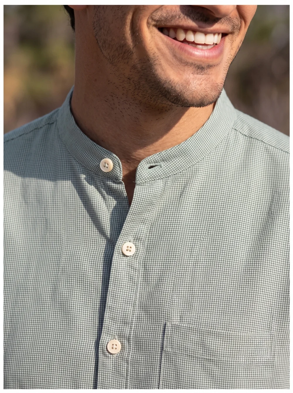 Green checked kurta, mandarin collar, buttoned front, worn by a model