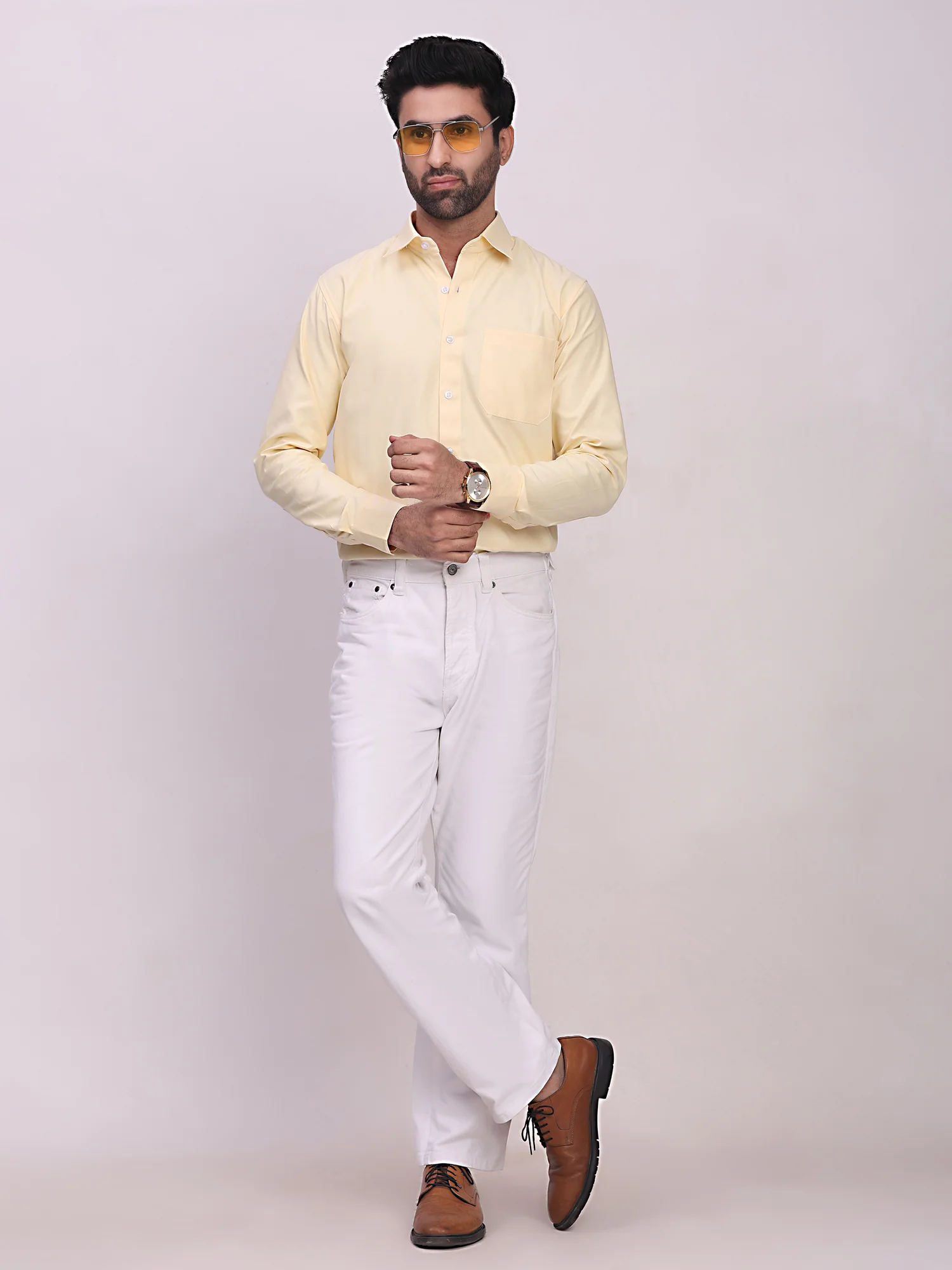 Model wearing yellow long-sleeve shirt, front view, with collar, button placket, and chest pocket