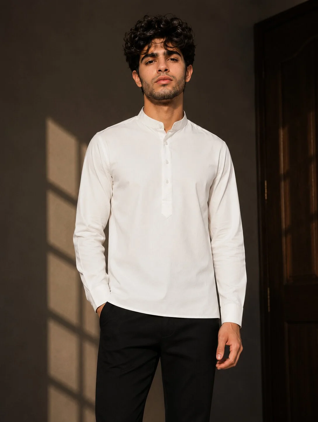 White short kurta, mandarin collar, long sleeves, five buttons front, worn by a model