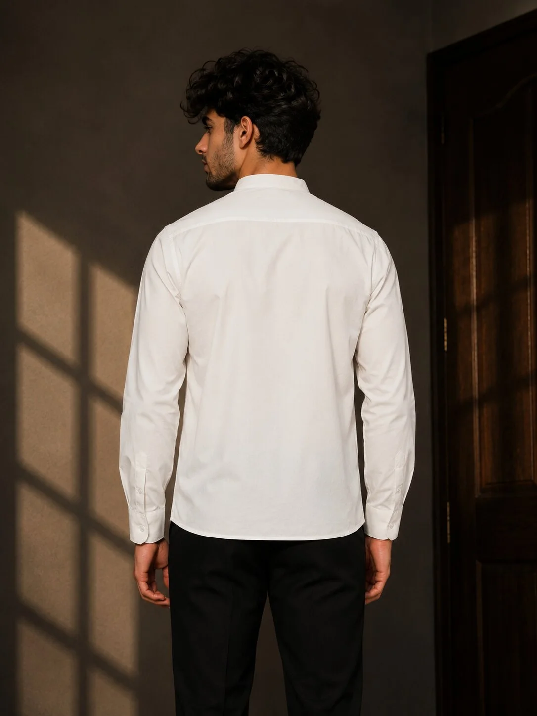 White short kurta, back view, worn by a model, collar and long sleeves visible