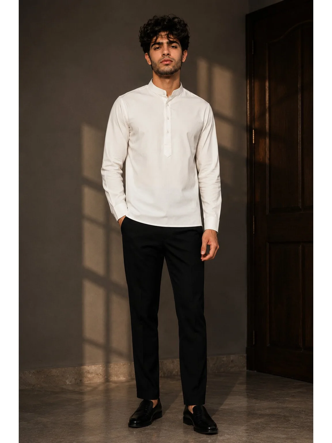 White short kurta, mandarin collar, buttoned placket, long sleeves, worn by a model