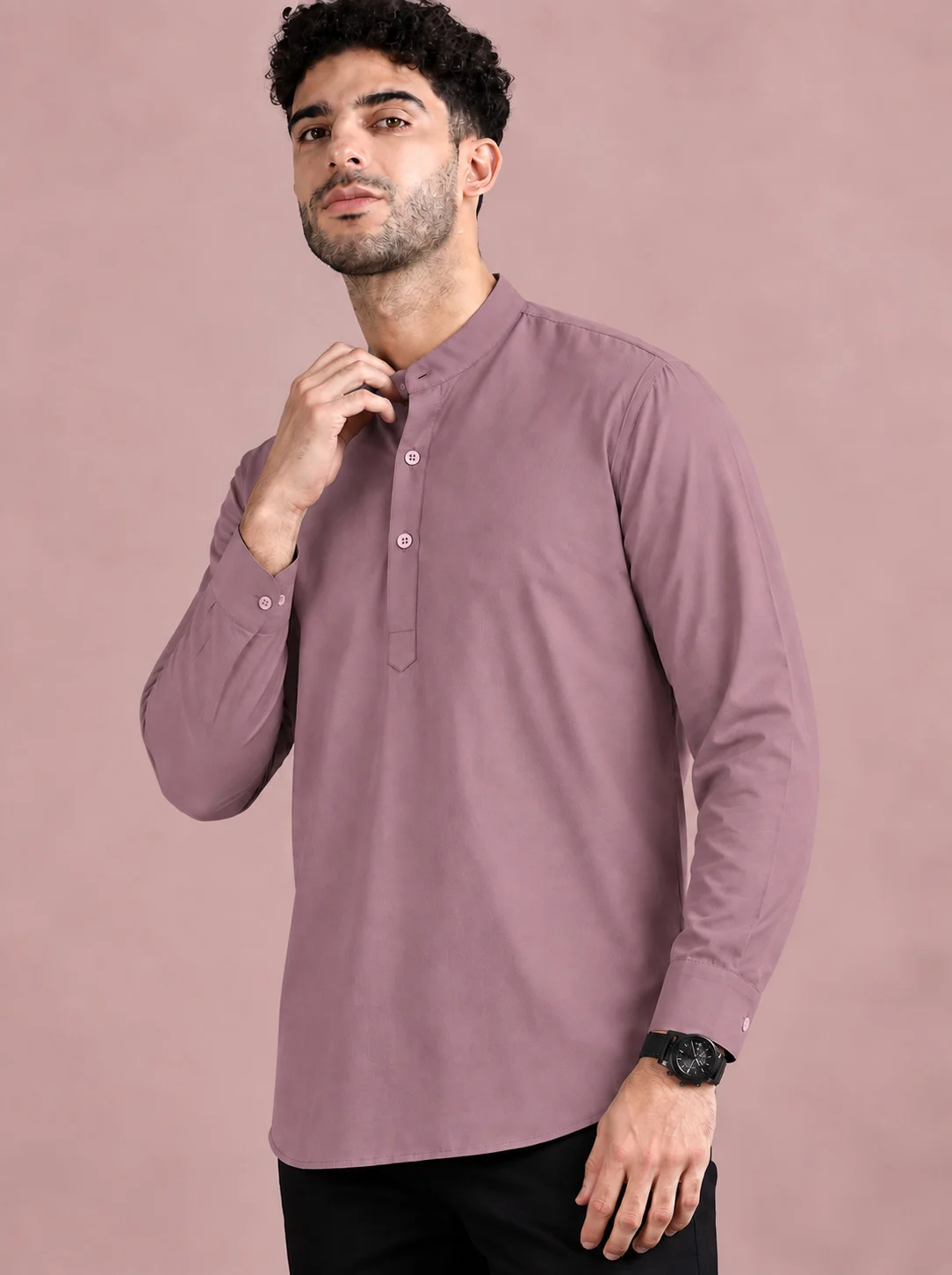 Mauve kurta, long sleeves, mandarin collar, buttons down front. Worn by a model