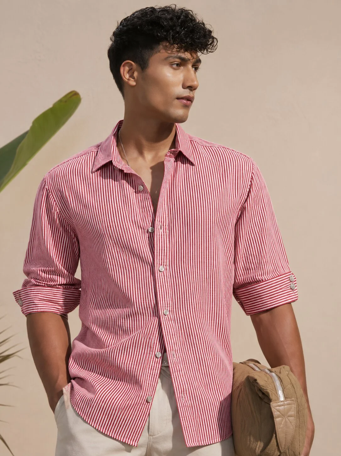 Pink and white striped shirt, front view, worn by a model, buttons, collar, rolled sleeves