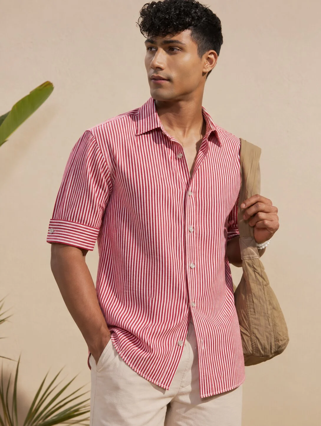Red and white striped short-sleeved shirt, collar, buttons, worn by a model