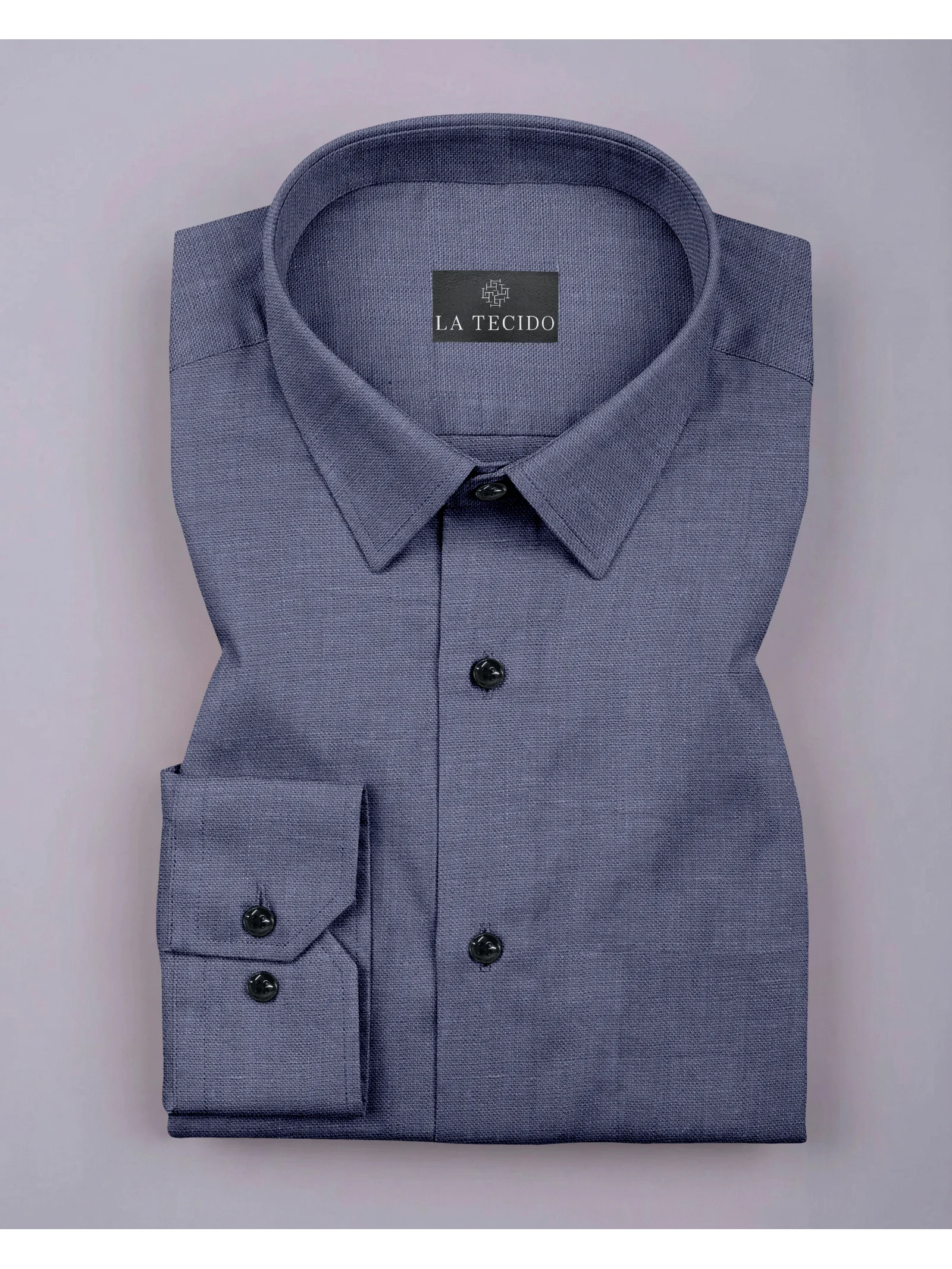 Blue dress shirt, folded, with collar, buttons, and cufflinks visible