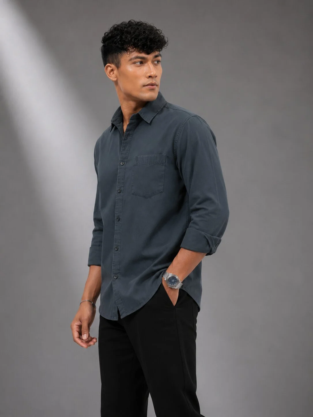 Model wearing charcoal grey long-sleeve shirt with collar, front buttons, and chest pocket