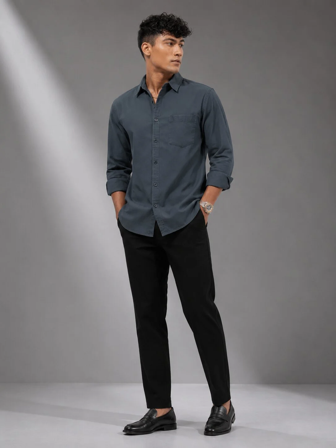 Charcoal grey long-sleeve shirt worn by a model with black trousers, front view