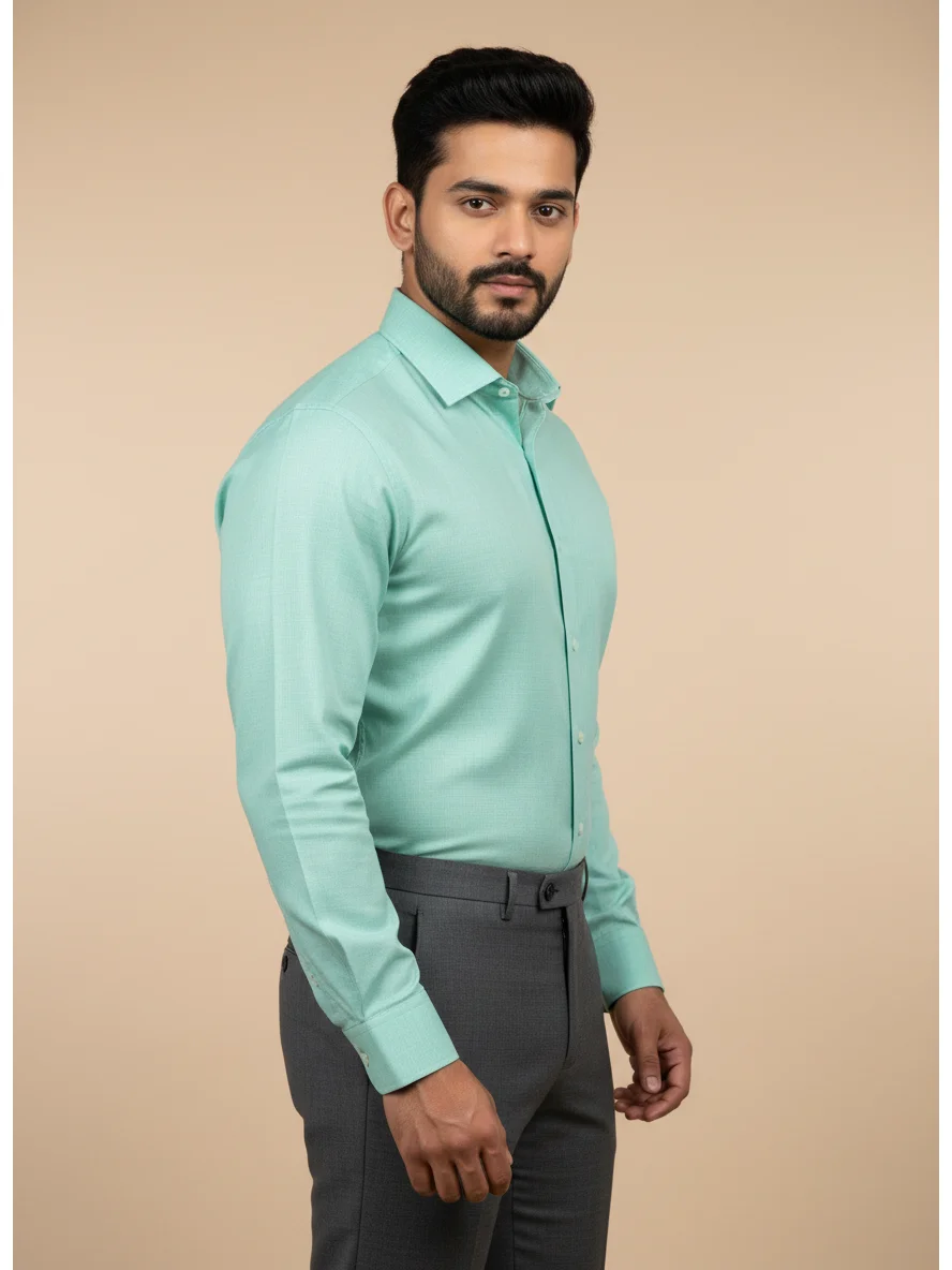 Sea green long-sleeve dress shirt, collar, buttons, worn by a model