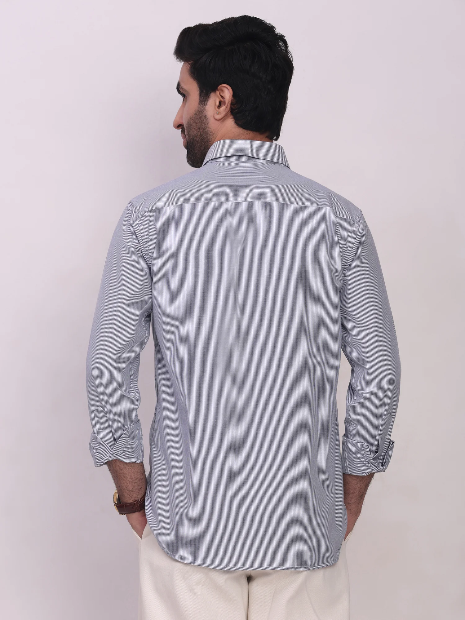 Blue striped long sleeve shirt, back view, worn by a model