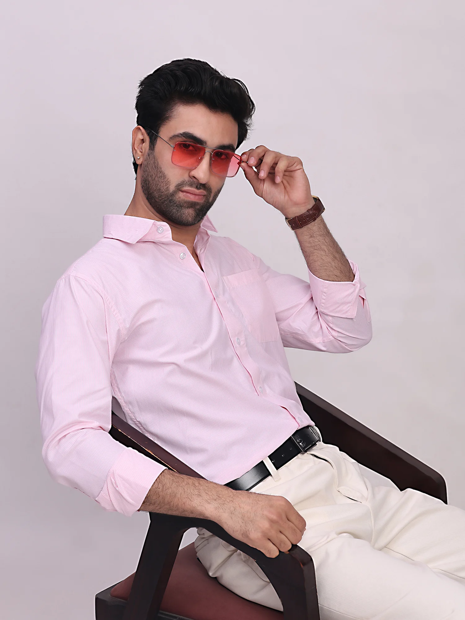 Pink striped shirt, front view, worn by a model, long sleeves, collar