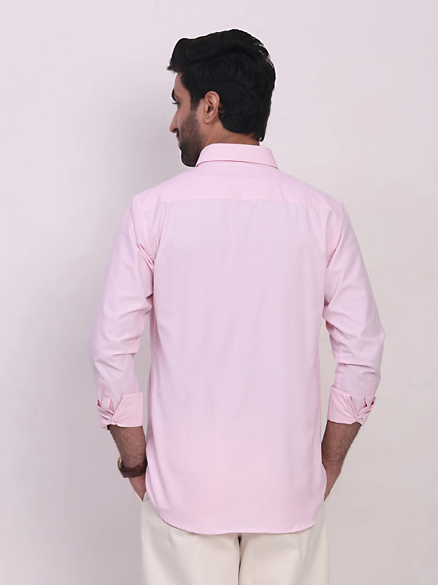 Pink striped shirt, back view, collar, long sleeves, worn by a model
