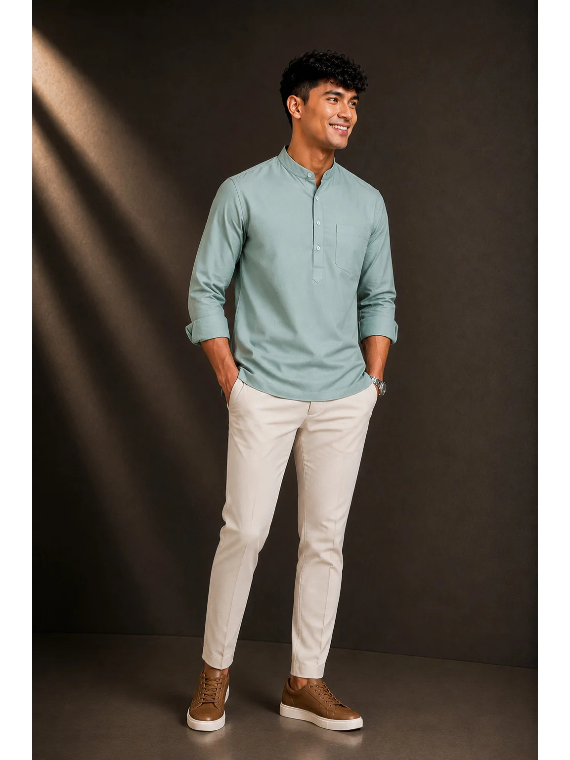 Model wearing sea green short kurta with mandarin collar, chest pocket, and button placket, paired with trousers