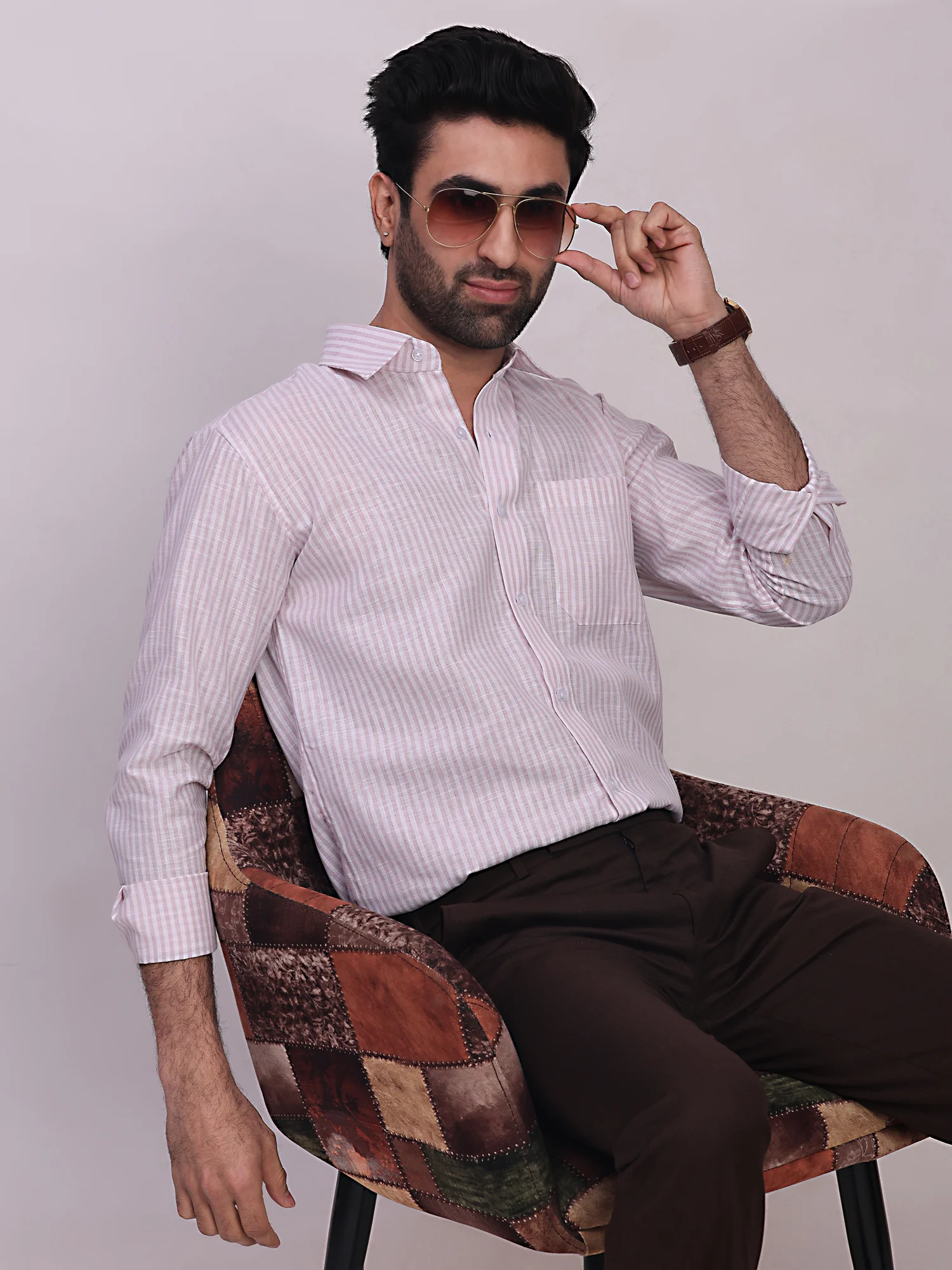 Pink and white striped shirt, front view, worn by a model, collar, buttons, chest pocket, long sleeves